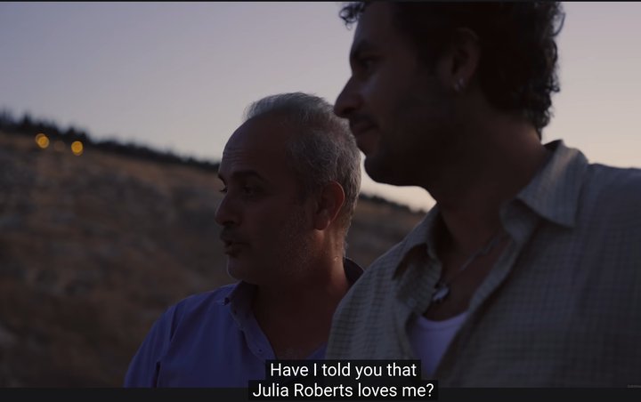 Bashar and Kareem at dusk above Damascus, subtitled "Have I told you that Julia Roberts loves me?"